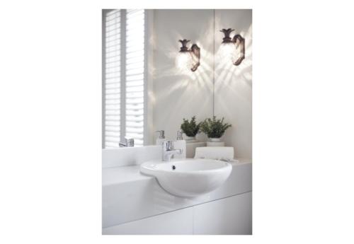 a white bathroom with a sink and birds on the wall at Verandah Retreat - A Beach House by the sea in Cowes