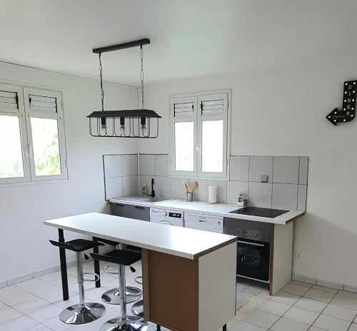 Virtuvė arba virtuvėlė apgyvendinimo įstaigoje Un Souffle de Vacances