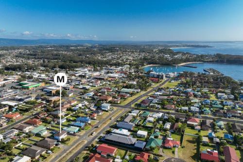 an aerial view of a city with the letter m at Coastal Breeze - 67 Burrill Street in Ulladulla