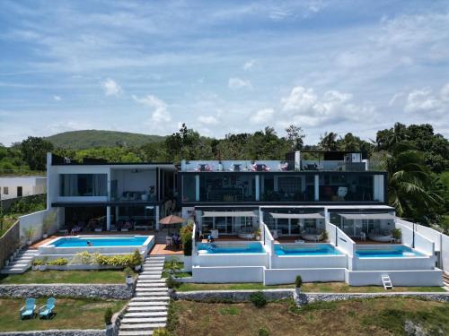 an aerial view of a house with two swimming pools at Epic Suites Bohol ADULTS ONLY in Dauis