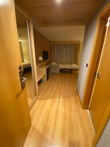 an open door to a room with a living room at U Hotel Villa-Gomá in Zaragoza
