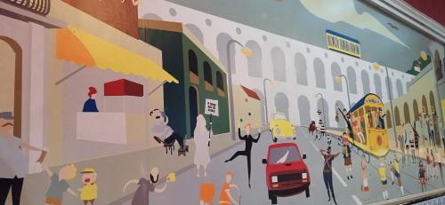a mural of a street scene on a wall at Lapa Bed & Breakfast in Rio de Janeiro