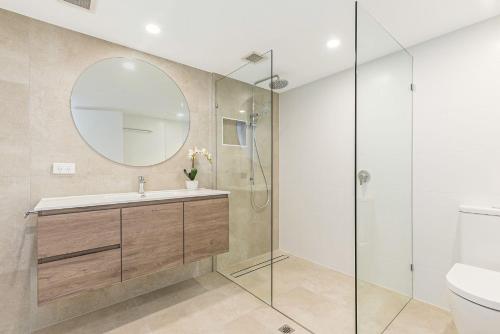 a bathroom with a sink and a mirror at Quarterdeck in Noosaville