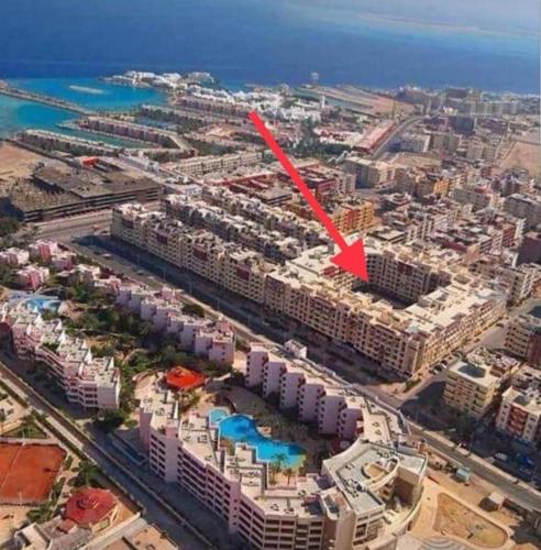 an aerial view of a city with a red arrow at Studio in hurgada in Hurghada