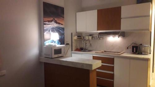 a small kitchen with a microwave on a counter at Studio in hurgada in Hurghada
