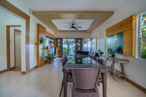 a dining room with a table and chairs at Oceanside 2 bedroom house, 50Mbps WiFi in Panglao Island