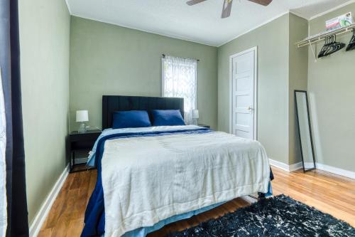 a bedroom with a bed and a ceiling fan at Humble home with free breakfast offered if requested! in Chicopee