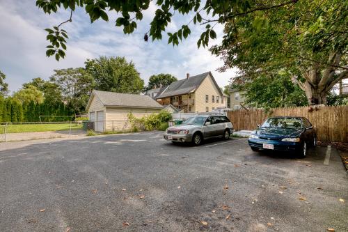two cars parked in a driveway in front of a house at Humble home with free breakfast offered if requested! in Chicopee