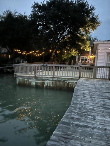 a wooden bridge over a body of water at Boat House Studio - Water Front Pets WiFi Smart TV apts in Norfolk