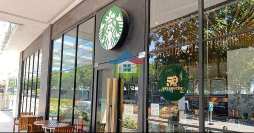 a store front with a clock on the wall at Mactan Newtown Beach Condo in Mactan