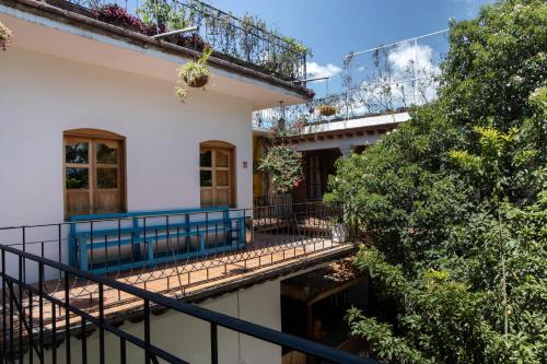 a view of a house with a balcony at NaNa Vida Hotel Oaxaca in Oaxaca City
