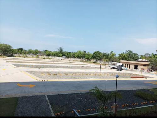 a large empty parking lot with a truck in the distance at Saekyung village one phase 3 in Suba