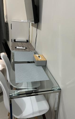 a glass desk with a drawer and a box on it at Saekyung village one phase 3 in Suba