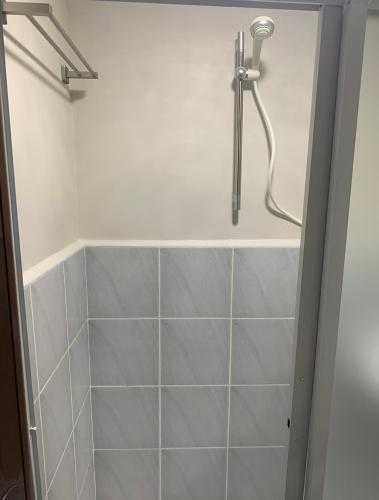 a shower with a shower head in a bathroom at Saekyung village one phase 3 in Suba