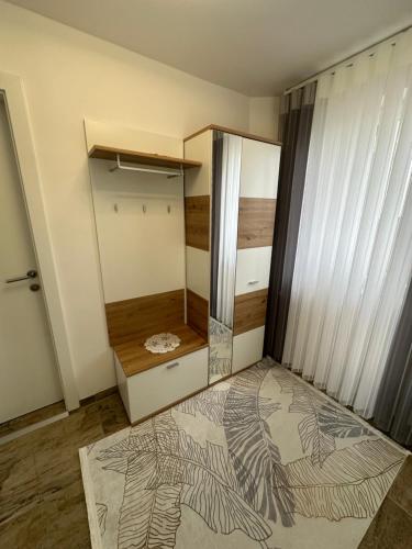 a small room with a closet with a mirror at Ferienwohnung Schwanenstadt in Oberndorf bei Schwanenstadt