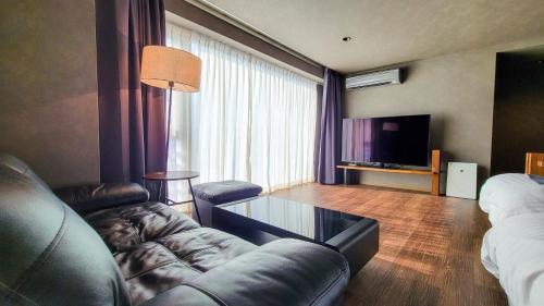 TV a/nebo společenská místnost v ubytování Business Resort Kyuan