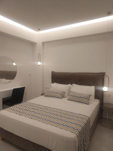 Postel nebo postele na pokoji v ubytování Oceana Suites