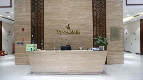 a lobby with a yampa sign on a wall at LANDMARK PLUS RESIDENCES LUXURY SUITE in Ho Chi Minh City