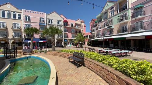 a city street with a swimming pool and buildings at Couples Getaway - Sweet Retreat - European Village Best Location in Palm Coast