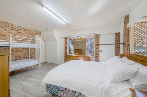 a bedroom with a bed and bunk beds in it at Absolute Waterfront in North Haven