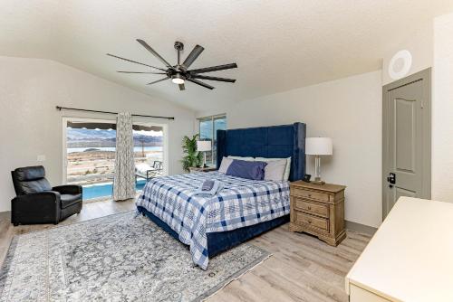 a bedroom with a bed and a ceiling fan at LakeView Home Minute From New Launch With Pool And Spa in Lake Havasu City