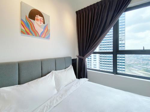 a bedroom with a bed and a large window at Arte Plus Ampang in Kuala Lumpur