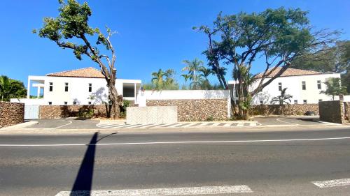 a shadow of a person walking down a street at Villa TE URA Beach in Paea