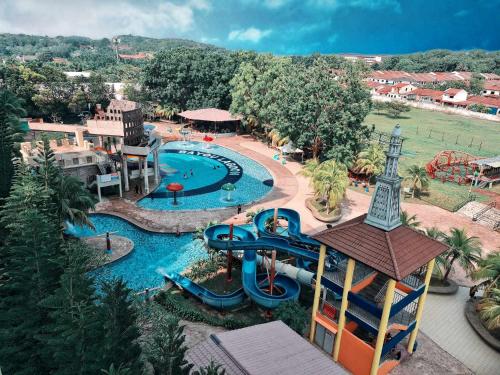 an aerial view of a water park with a water slide at Melaka Top Largest Waterpark Resort - By YouBNB Homestay Melaka in Melaka