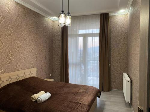 เตียงในห้องที่ Apartment in Tbilisi Eristavi