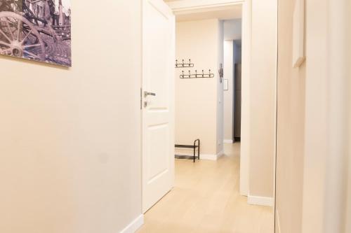 a hallway with a door leading into a room at Arò Design Suite in Asti