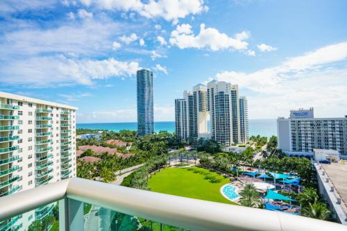 a balcony with a view of the ocean and buildings at OCEAN RESERVE 15th Floor - Gorgeous Ocean View - STR00907 in Miami Beach