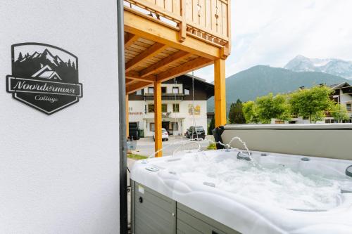 a bathroom with a sink in a balcony at Bubbelen aan de piste in Kötschach