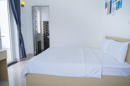 Ένα ή περισσότερα κρεβάτια σε δωμάτιο στο An Gia Hotel Tây Ninh