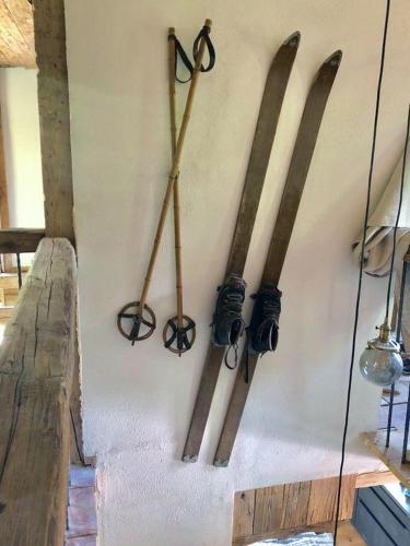 a group of skis hanging on a wall at Schönbacher Hof in Hopfgarten im Brixental