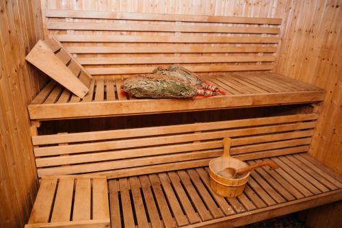 a inside of a sauna with a bucket in it at Casa Octavian in Suceviţa