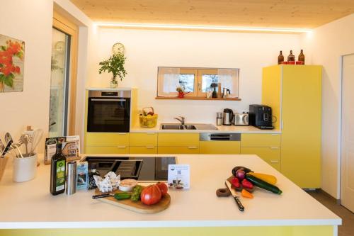 a kitchen with a counter with vegetables on it at Feldhasen in Bad Ischl