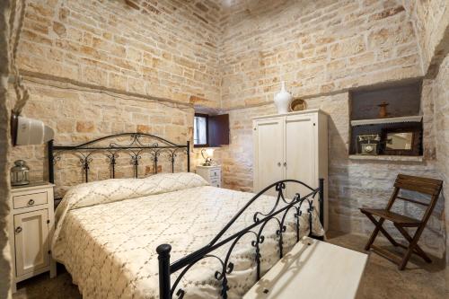 Giường trong phòng chung tại Trullo Relax