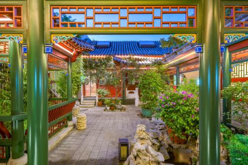 Jardín al aire libre en 北京悦明元星空白塔景观四合院民宿