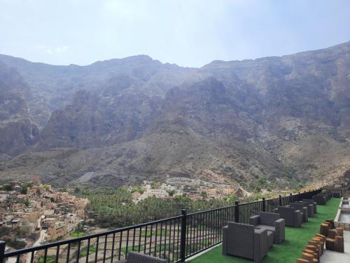 a balcony with a view of the mountains at Season Inn Hotel_Bald Sayt in Rustāq