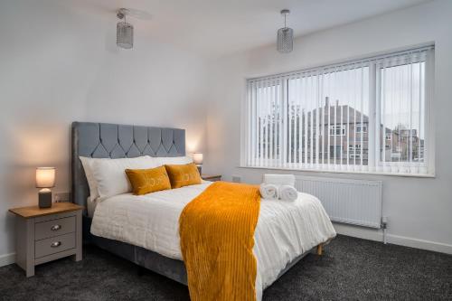 a bedroom with a large bed and a window at Borrowdale Brook in Moortown
