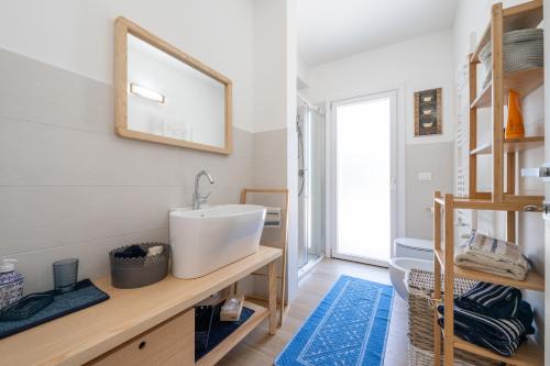 a bathroom with a sink and a mirror on the wall at Villa Maya in Pula