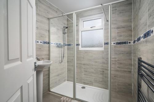 a bathroom with a shower and a sink at Borrowdale Brook in Moortown