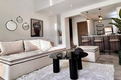 a living room with a couch and a table at Dream Appartment in La Marsa
