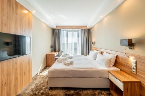 Кровать или кровати в номере Blue&Green Baltic Hotel mediSPA&fit