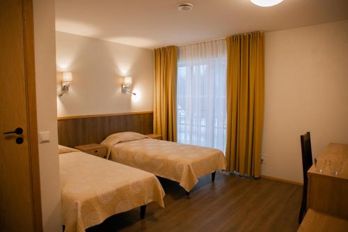 Ένα ή περισσότερα κρεβάτια σε δωμάτιο στο Vanaõue
