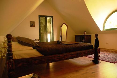 A bed or beds in a room at Sárga Ház