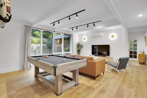 a living room with a pool table in it at Haven at Rye by Ready Set Stay - BYO LINEN & TOWELS in Rye