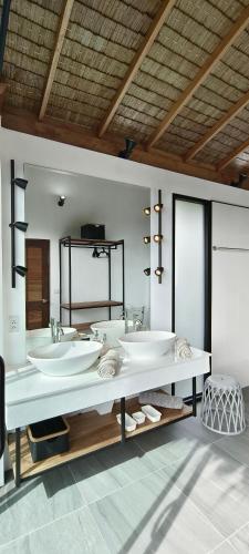 a bathroom with three sinks in a room at Villa on the Rock - Luxury, Privacy, Pool, Sea View in Koh Phangan in Thong Sala
