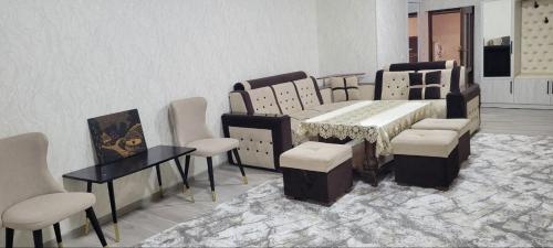 a dining room with a table and some chairs at Imran&Bek in Samarkand