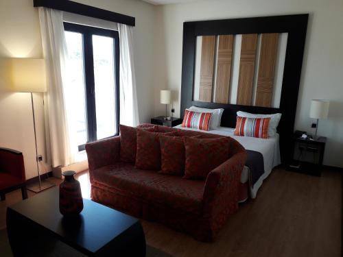Ένα ή περισσότερα κρεβάτια σε δωμάτιο στο Hotel Lisboa